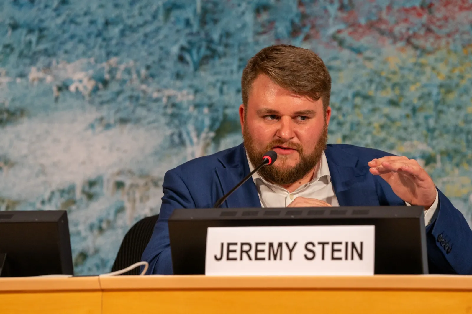 Jeremy T. Stein speaking on a panel at the AIFOD Geneva Summit 2026 in the Palais des Nations